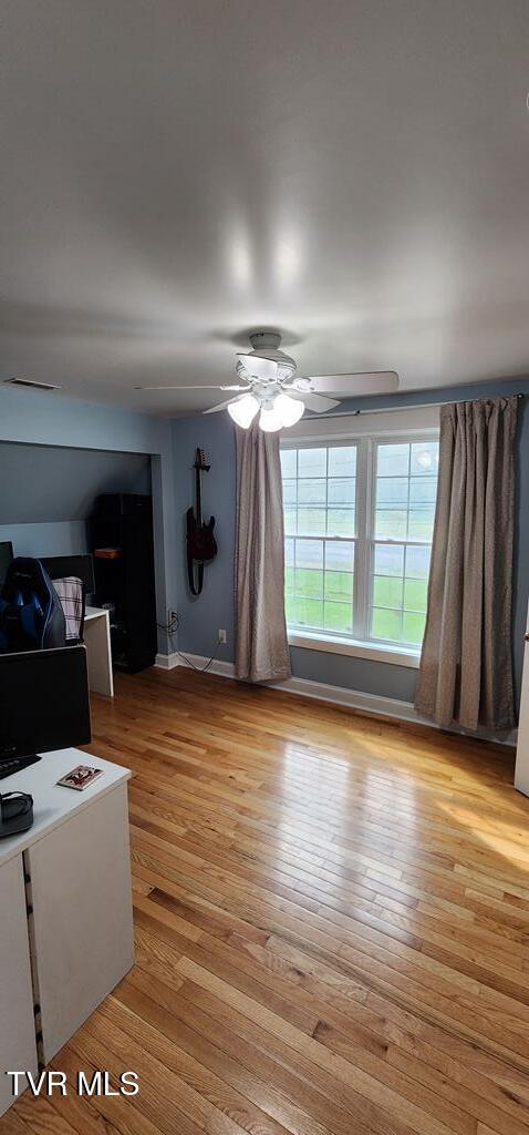 interior space featuring ceiling fan and light hardwood / wood-style flooring