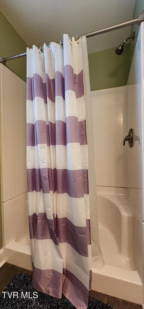 bathroom with a shower with curtain