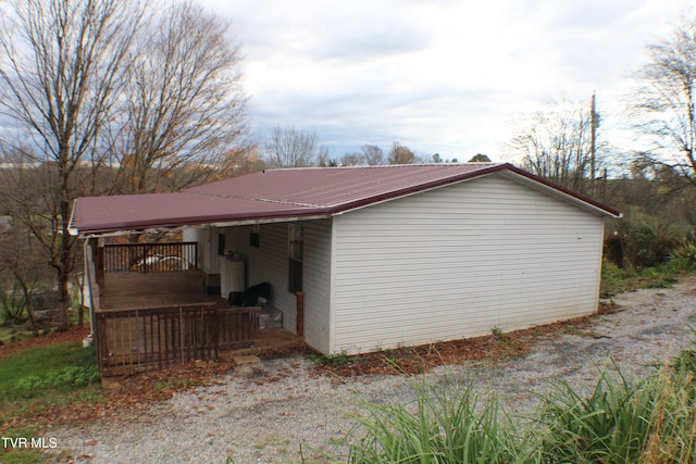 view of home's exterior with a wooden deck