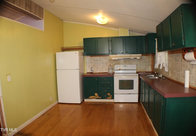 kitchen featuring white appliances, ventilation hood, vaulted ceiling, and light hardwood / wood-style flooring