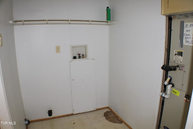 washroom with hookup for an electric dryer and hookup for a washing machine