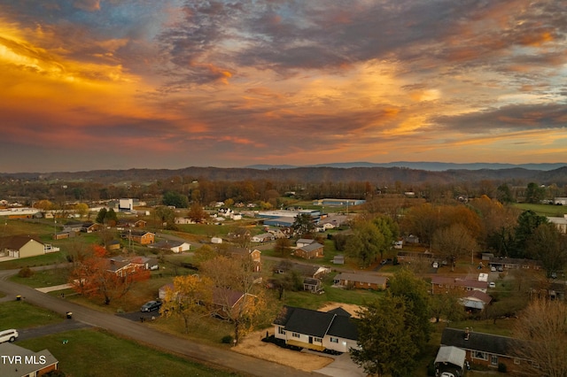 aerial view at dusk with a mountain view