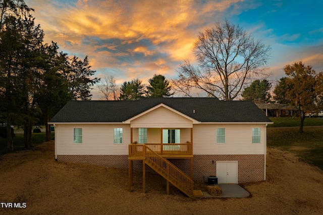 view of back house at dusk