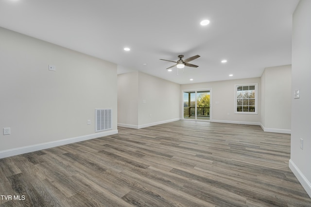 unfurnished living room with ceiling fan and light hardwood / wood-style floors