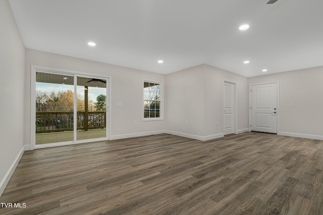 unfurnished room featuring dark hardwood / wood-style flooring