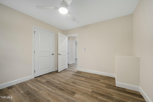 unfurnished bedroom featuring wood-type flooring and ceiling fan