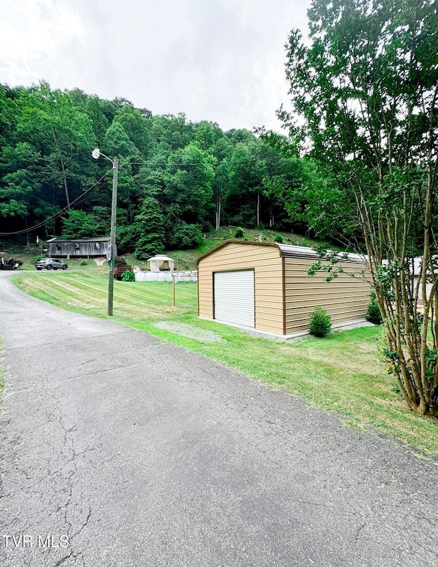 garage featuring a lawn