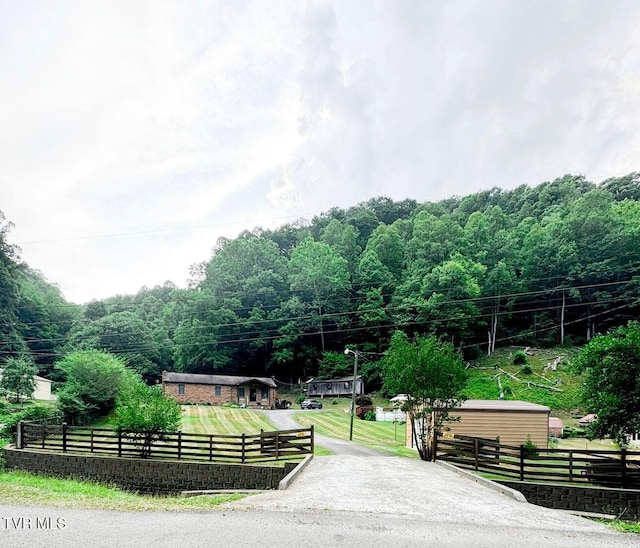 view of home's community featuring a lawn