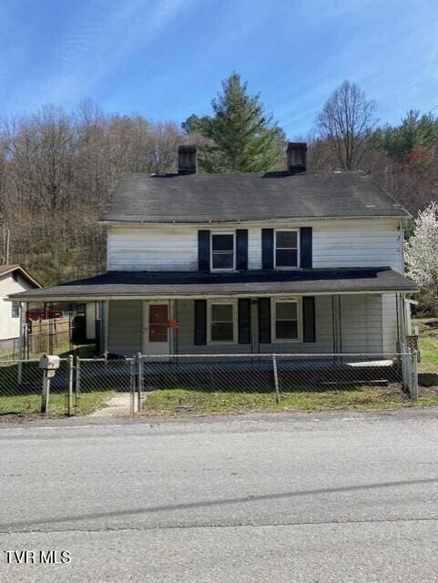 5332 Stonega Rd, Appalachia, VA 24216 - farmhouse inspired home featuring a porch, a chimney, and a gate