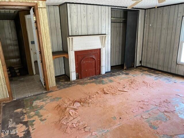 5332 Stonega Rd, Appalachia, VA 24216 - unfurnished living room featuring wooden walls