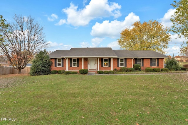 ranch-style house featuring a front lawn