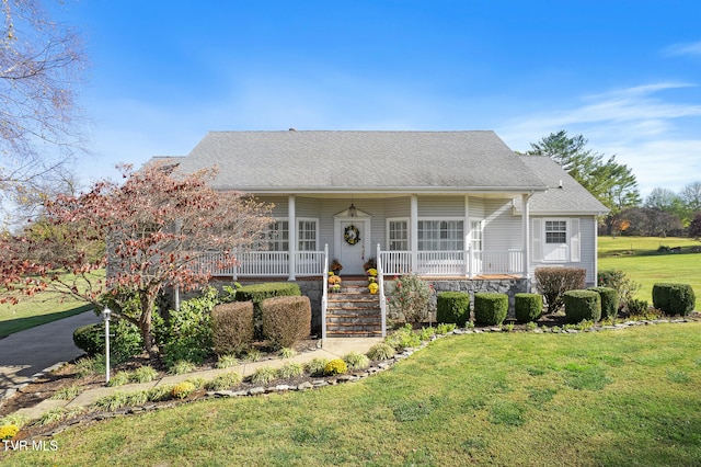 view of front of home featuring covered porch and a front yard