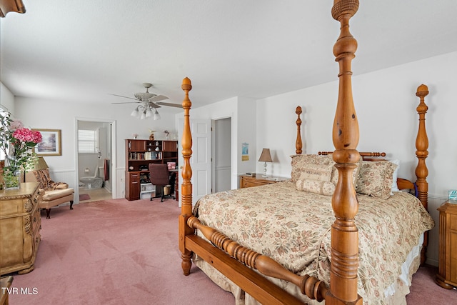 bedroom featuring carpet floors, ensuite bathroom, and ceiling fan