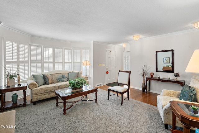 living room with a healthy amount of sunlight, dark hardwood / wood-style flooring, and ornamental molding