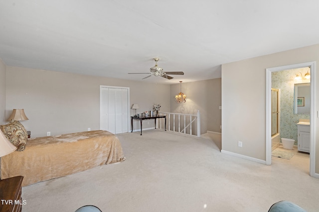 carpeted bedroom featuring ceiling fan, connected bathroom, and a closet