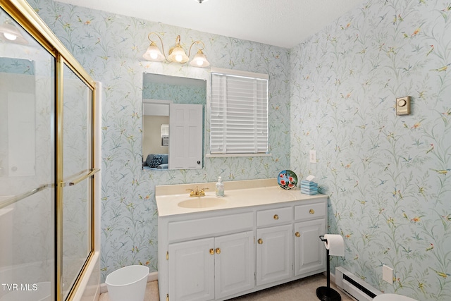 bathroom featuring shower / bath combination with glass door, a textured ceiling, vanity, and baseboard heating