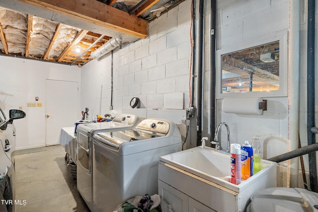 laundry area featuring sink and washer and dryer