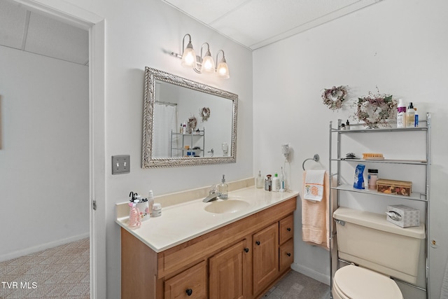 bathroom with vanity and toilet