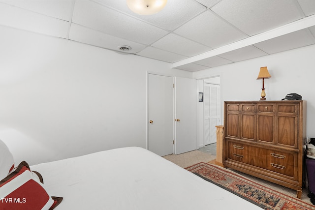 bedroom featuring a drop ceiling