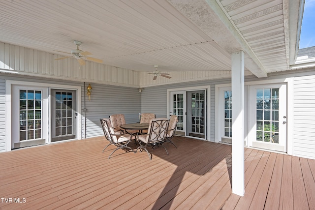 wooden terrace with ceiling fan and french doors