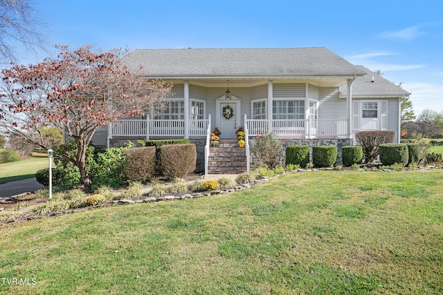 single story home featuring a front yard and covered porch