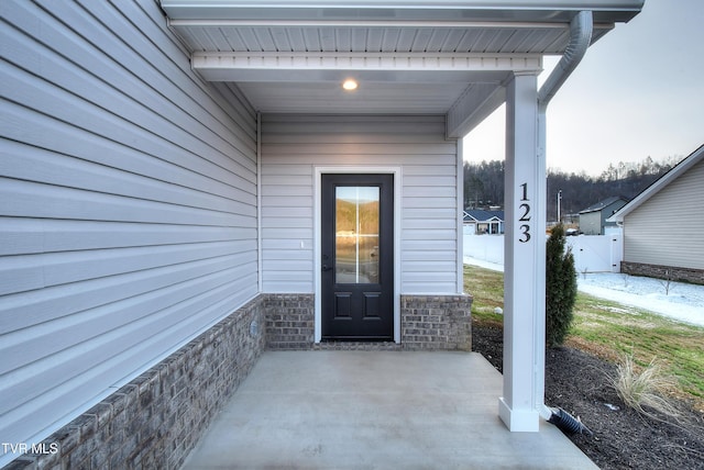 doorway to property featuring a patio area