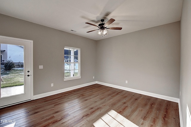 unfurnished room with ceiling fan and wood-type flooring