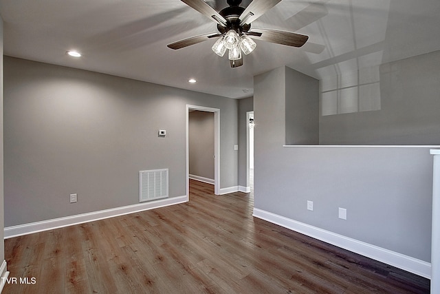 empty room featuring ceiling fan and light hardwood / wood-style floors