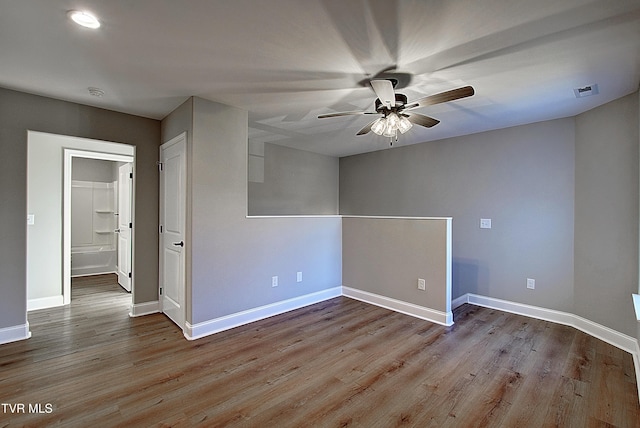 spare room with ceiling fan and light hardwood / wood-style floors