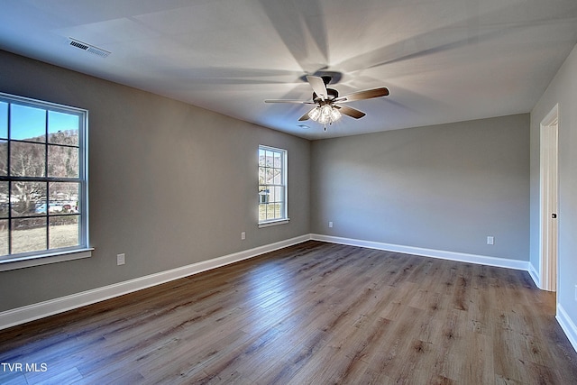 empty room featuring ceiling fan and light hardwood / wood-style floors