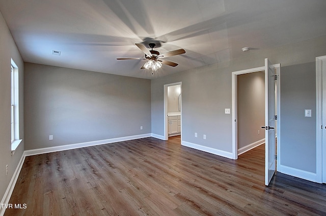 unfurnished bedroom with ceiling fan, light hardwood / wood-style floors, and ensuite bathroom