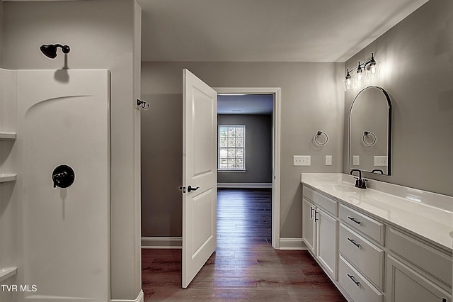 bathroom featuring wood-type flooring and vanity