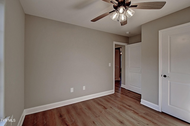 unfurnished bedroom featuring ceiling fan and light wood-type flooring