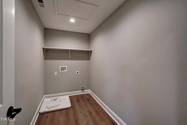 clothes washing area featuring washer hookup, hardwood / wood-style flooring, and electric dryer hookup