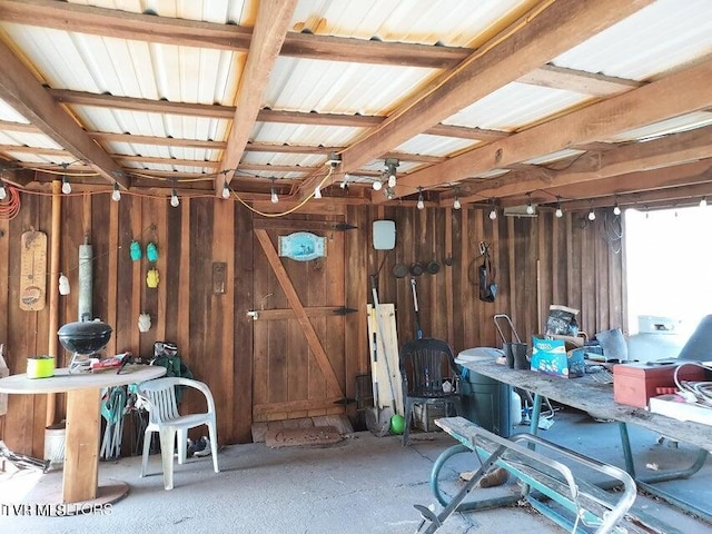 miscellaneous room with wooden walls