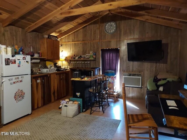 kitchen with vaulted ceiling with beams, white refrigerator, wooden ceiling, and a breakfast bar area