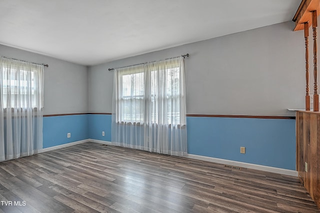 empty room featuring wood-type flooring