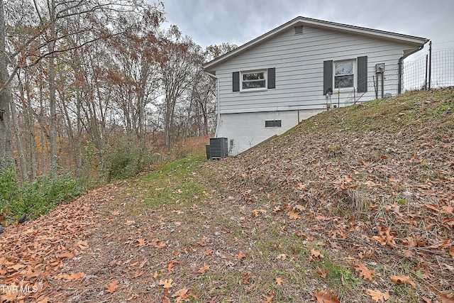 view of side of home with cooling unit