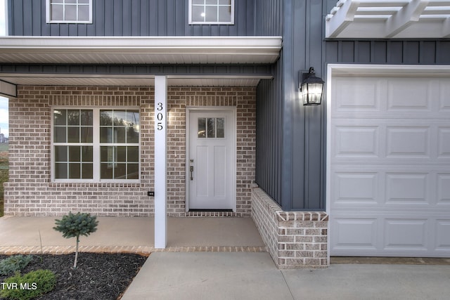 view of exterior entry featuring a garage