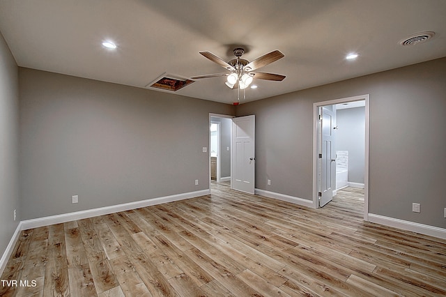 empty room featuring ceiling fan and light hardwood / wood-style flooring