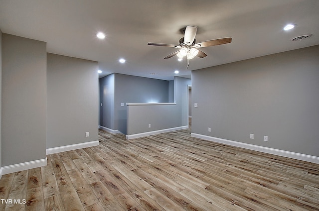 spare room with ceiling fan and light hardwood / wood-style flooring