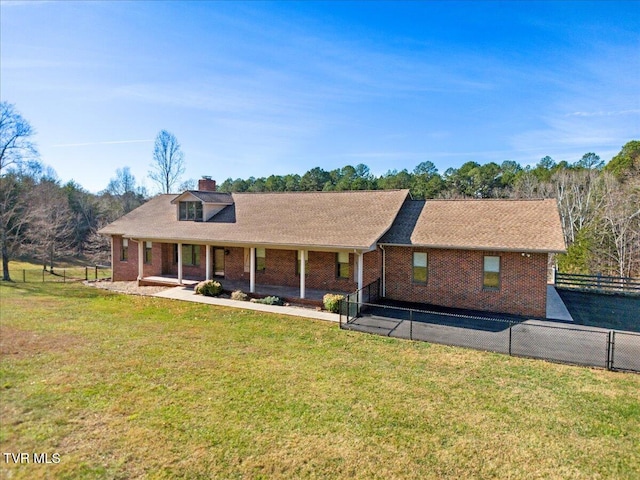 view of front facade with a patio area and a front yard