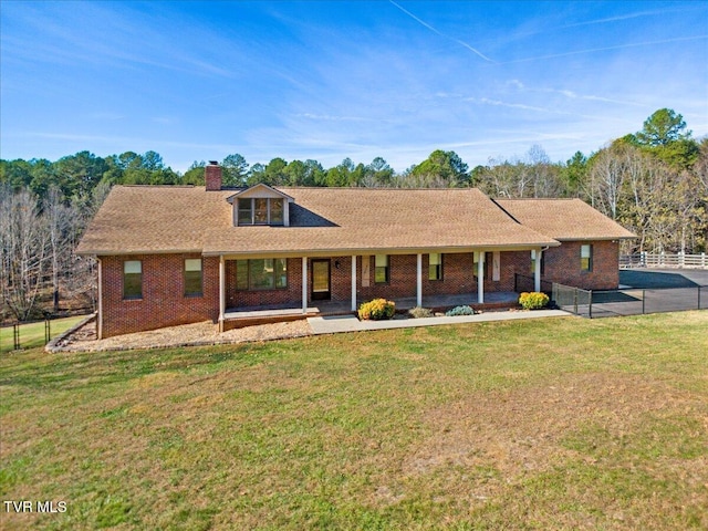 ranch-style home with a front lawn