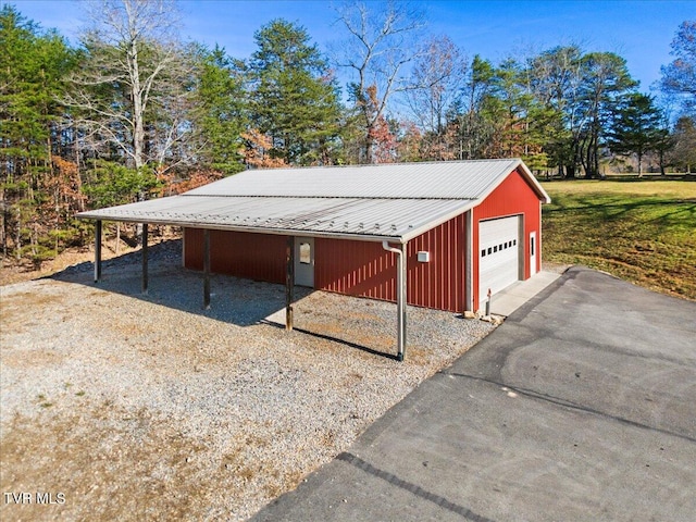 exterior space with a carport and a garage