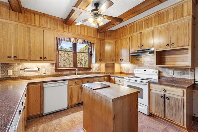 kitchen with backsplash, white appliances, sink, beamed ceiling, and a kitchen island