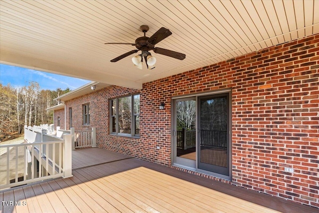 wooden terrace featuring ceiling fan