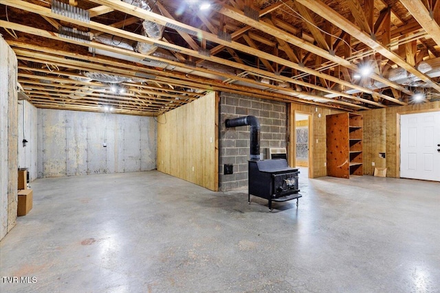 basement featuring a wood stove