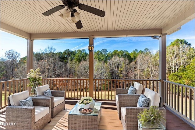 wooden deck featuring ceiling fan and an outdoor hangout area