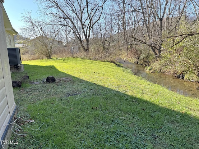 view of yard with central AC