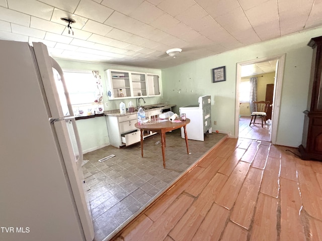 dining space with light wood-type flooring